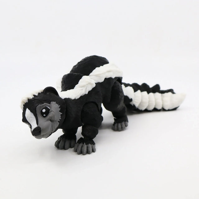 Black and white 3D printed skunk sensory toy with articulated segments on white background