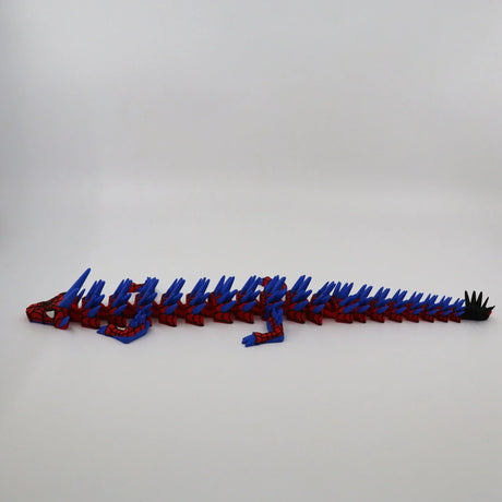 Red and blue 3D printed flexi dragon toy with articulated segments for sensory play