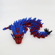 Red and blue 3D printed dragon fidget toy with spikes, designed for sensory play and tactile engagement.