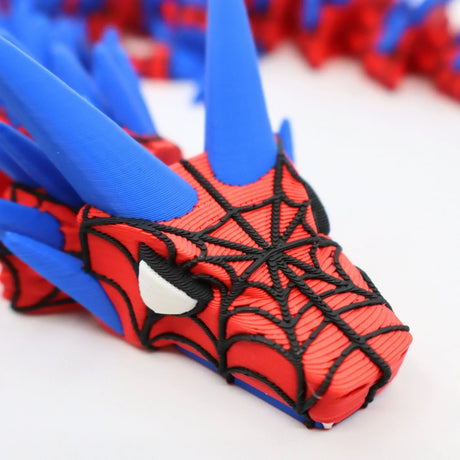 3D printed Spider-Man fidget toy with red, blue, and black web design for sensory play