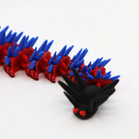 Red and blue 3D printed spiky caterpillar fidget toy with black head for sensory play