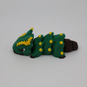 Green and yellow caterpillar-shaped sensory toy with brown accents on a white background
