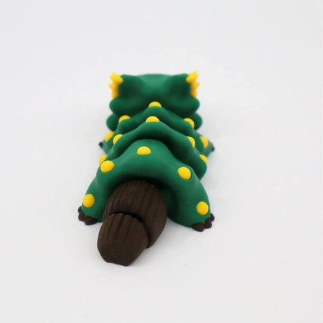 Green 3D printed caterpillar sensory toy with yellow spots and brown segmented tail on white background.