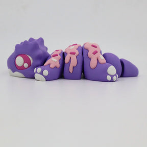 Purple 3D printed sensory toy animal with pink sprinkle details and articulated segments