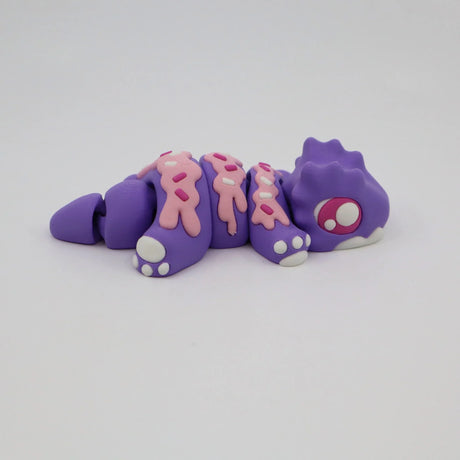 Purple and pink 3D printed sensory caterpillar toy with segmented body on white background