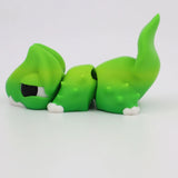 Green 3D printed sensory toy lizard with articulated tail on white background