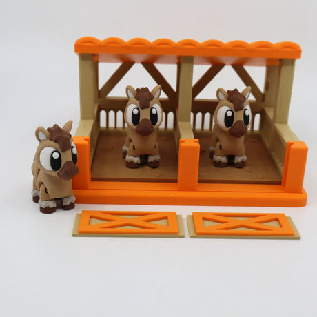 3D printed sensory toy horses in orange stable with two removable gates, educational toy setup