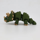 Green 3D printed triceratops sensory toy with flexible joints on white background