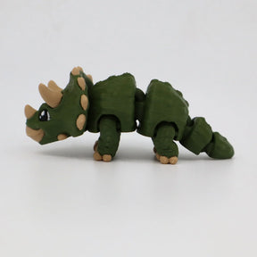 Green 3D printed triceratops sensory toy with flexible joints on white background