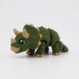 Green 3D printed flexible triceratops dinosaur sensory toy on a white background