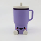 Purple 3D printed sensory toy mug with cute face and feet, ideal for fidgeting and tactile play.