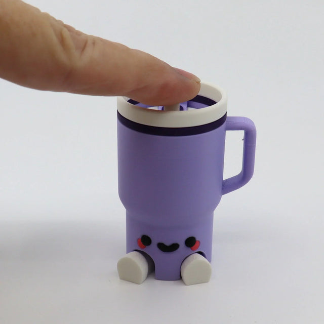 Purple 3D printed fidget toy mug with smiley face, clickable top, and rolling feet for sensory play