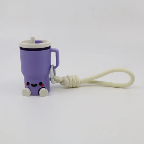 Purple 3D printed fidget toy shaped like a cup with handle, smiley face, and keychain loop for sensory play