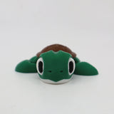 Green 3D printed turtle sensory toy with large eyes on white background