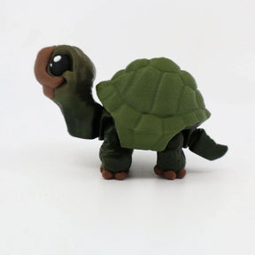 3D printed green turtle sensory toy with detailed shell and movable limbs on white background