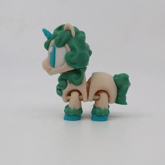 3D printed sensory unicorn toy with green mane, blue horn, and movable joints