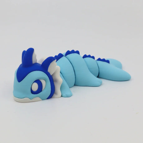 Blue and white 3D printed sensory toy in the shape of a cute dragon with segmented body
