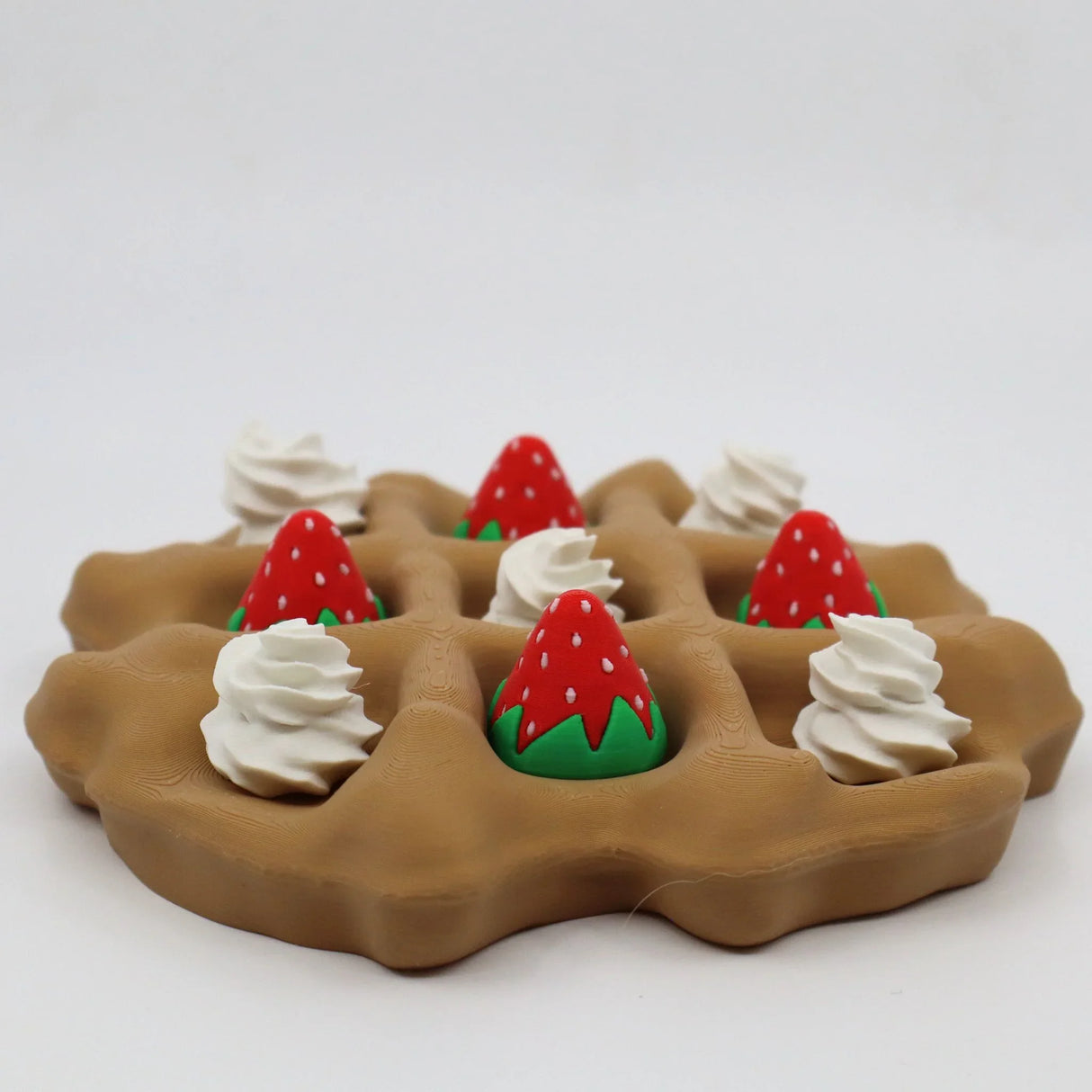 3D printed sensory waffle toy with whipped cream and strawberry pieces, tactile educational tool