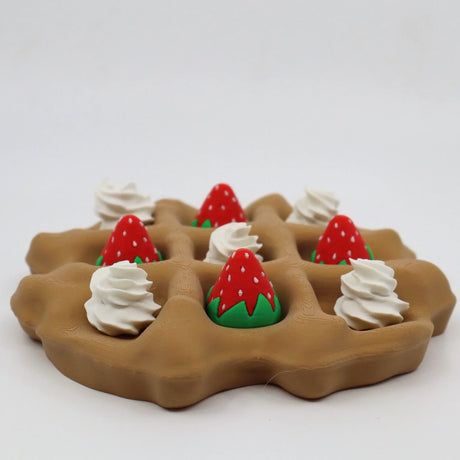 3D printed sensory waffle toy with whipped cream and strawberry pieces, tactile educational tool