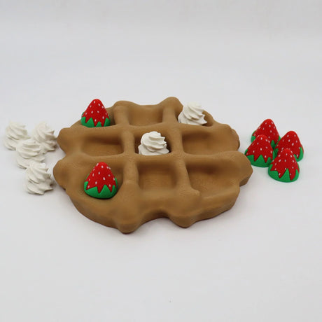 3D printed sensory toy waffle with removable strawberry and whipped cream pieces