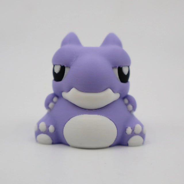 Cute purple 3D printed warthog sensory toy with white details on a plain background