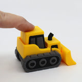 Hand pressing yellow 3D printed sensory toy bulldozer with black treads