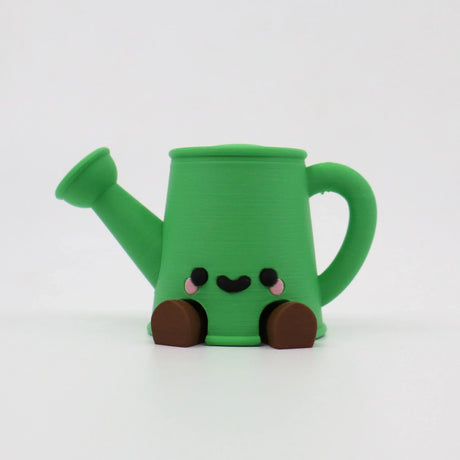 Green 3D printed watering can fidget toy with cute face and brown feet for sensory play