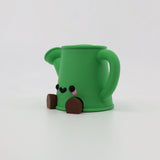 Green 3D printed koala fidget toy with cute face and brown feet, sensory friendly design
