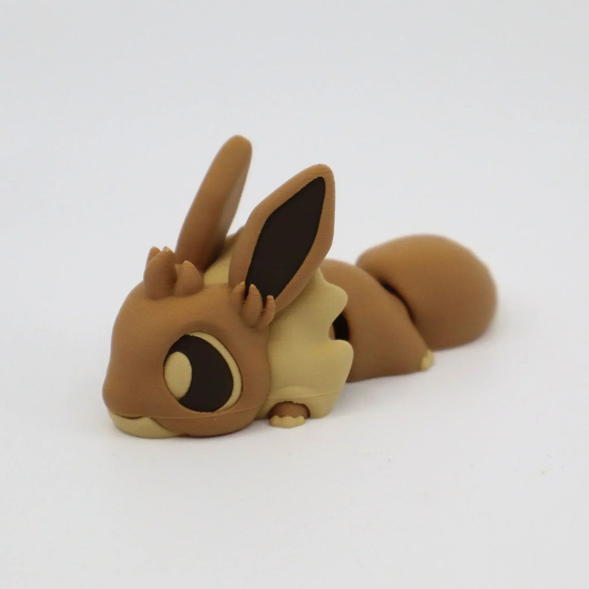 Cute brown 3D printed flexi animal sensory toy with large ears on white background