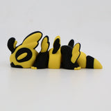Yellow and black 3D printed sensory toy shaped like a segmented bee on a white background